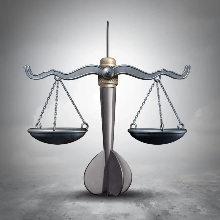 Artist rendering of the Scales of Justice with a dart representing the central shaft.